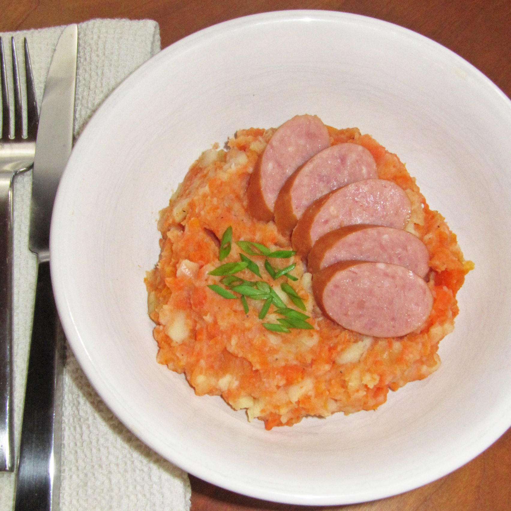 Hutspot Dutch, hochepot French or hotchpotch English, is a dish of boiled  and mashed potatoes, carrots and onions close up in the bowl on the table.  V Stock Photo - Alamy